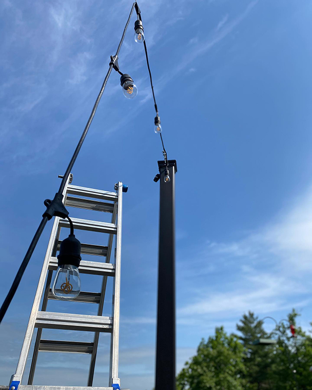 Patio bistro lighting installation